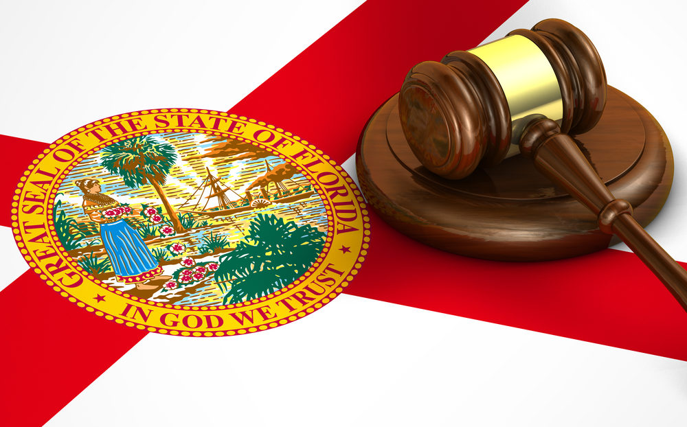 A gavel sits atop the Floridian flag