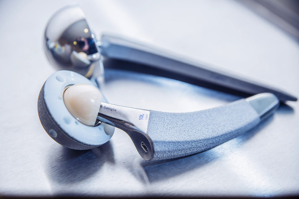 Close-up of an artificial hip joint on a metal table