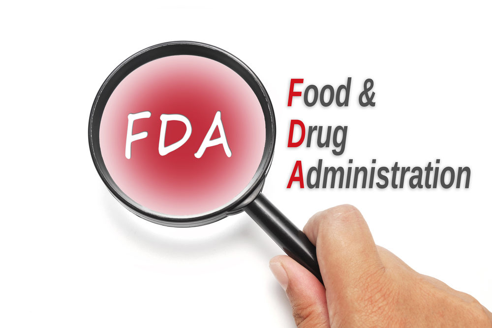FDA - Food & Drug Administration (artist rendering of magnifying glass with letters FDA in the lens)