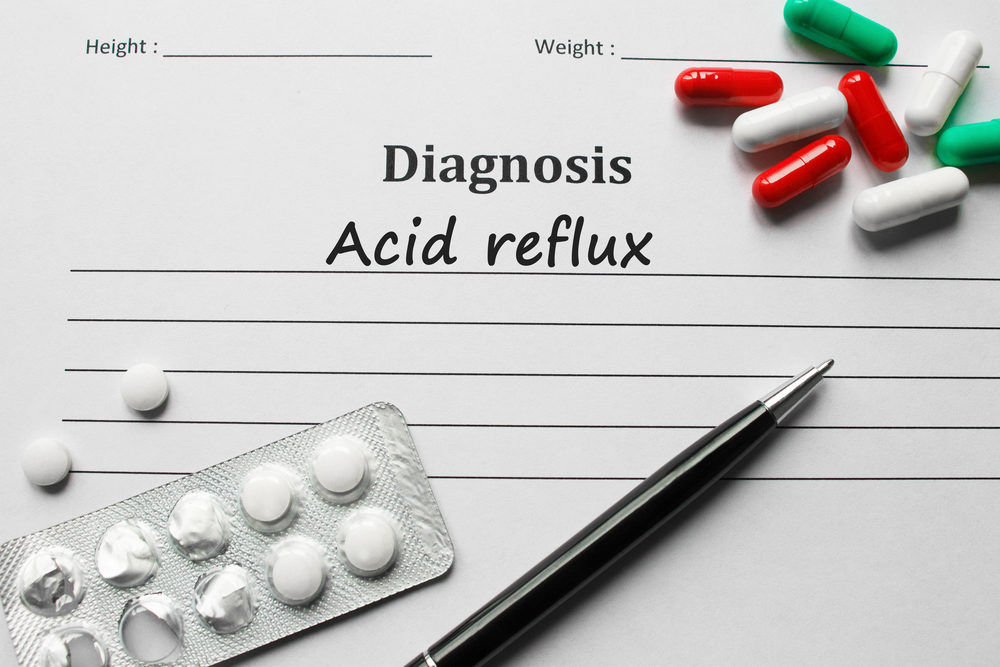 A doctor's note stating "Acid Reflux"