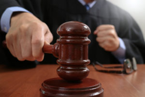 A judge striking a gavel