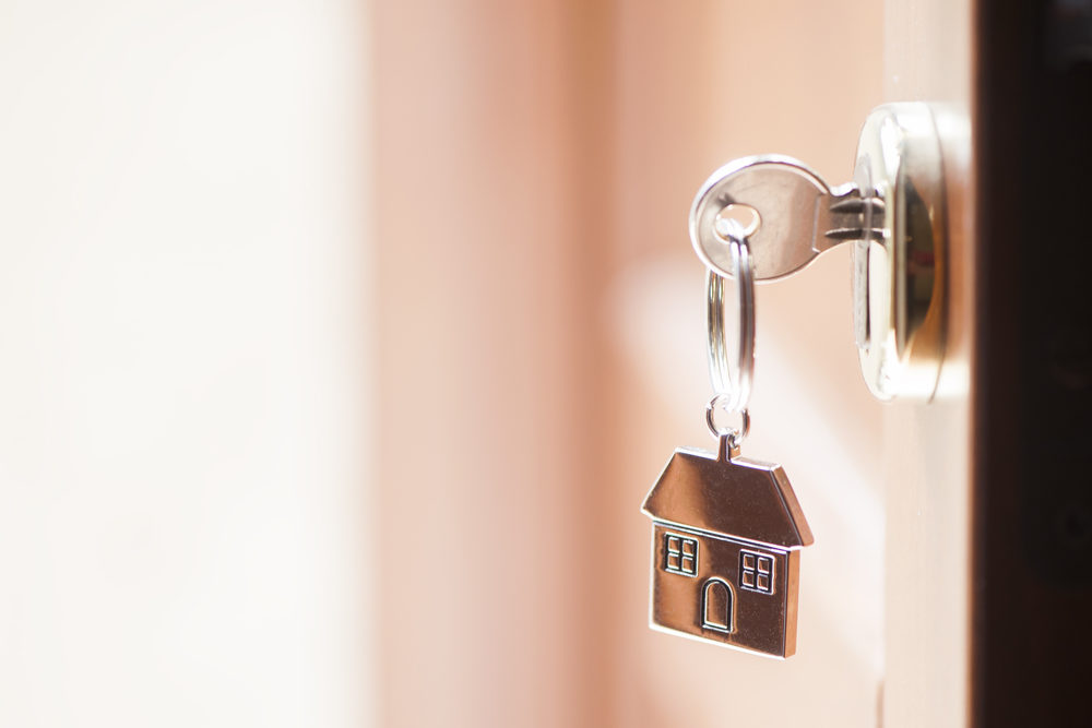 Pursuing a Virginia Premises Liability Lawsuit A key with a house-shaped keychain inserted into a lock