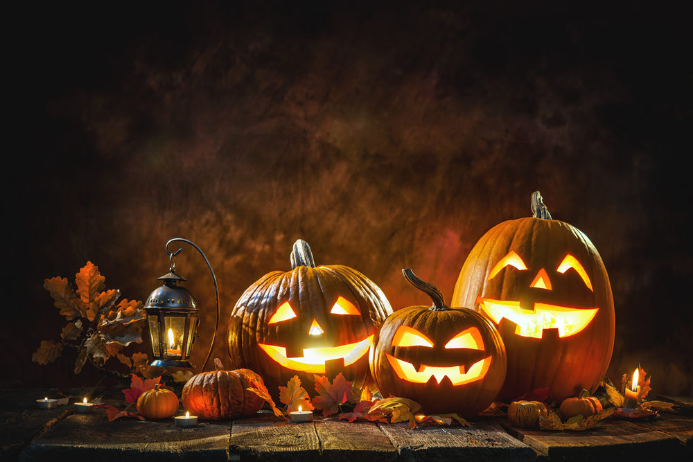 Halloween Hazards: Drunk Driving and Pedestrian Accidents Three carved Jack-o-lanterns with burning candles