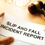 A SLIP AND FALL INCIDENT REPORT being filled out by an attorney