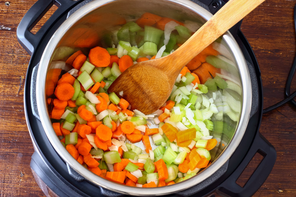 A mirepoix of carrots, celery and onions is prepared in an Instant Pot