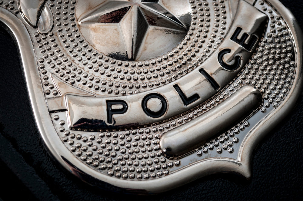 A tarnished POLICE badge