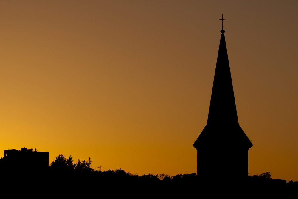 Church steeple silhouette at sunset