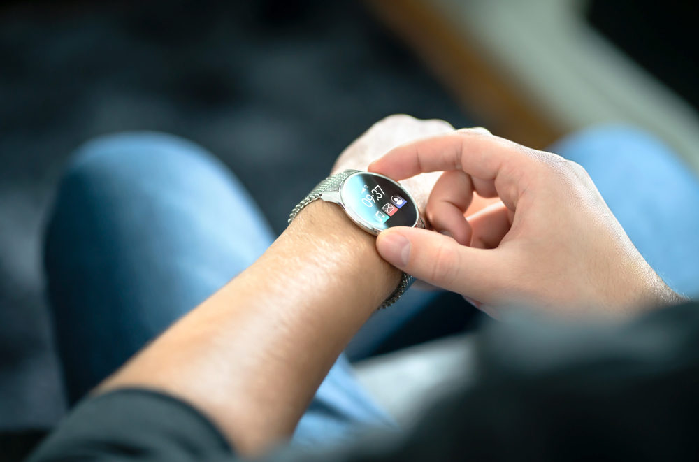 Person using smartwatch for business and work.