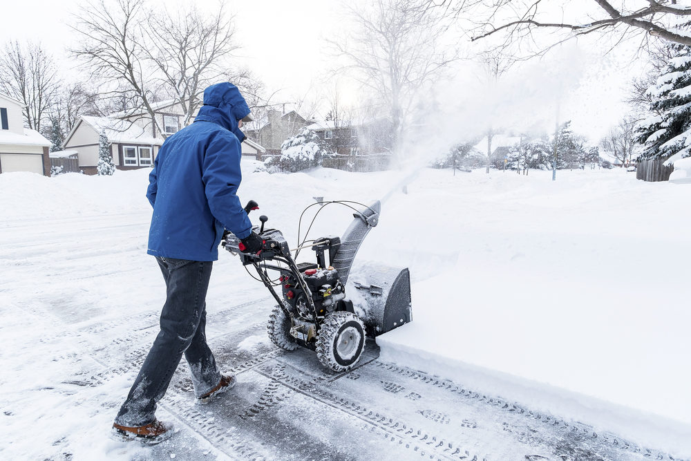 Toro Recalls Over 6,000 Snow Throwers for Potential Amputation Hazard Man Clearing Snow with a Snow Blower