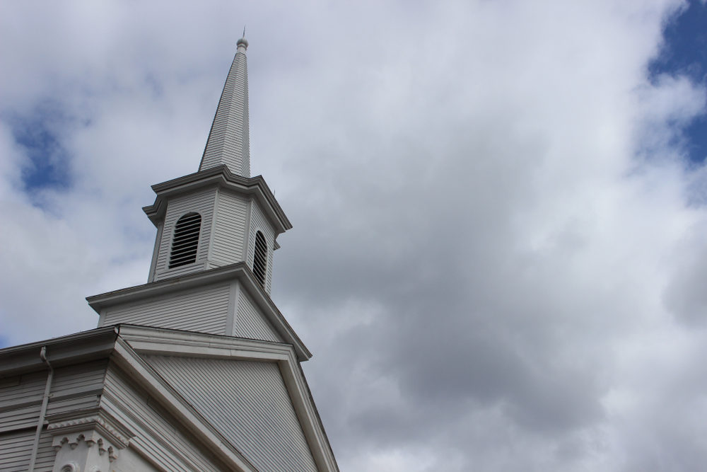 steeple of wooden white country church