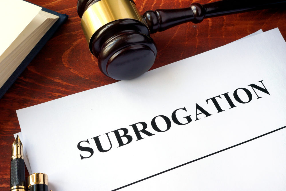 Document with title subrogation and gavel.