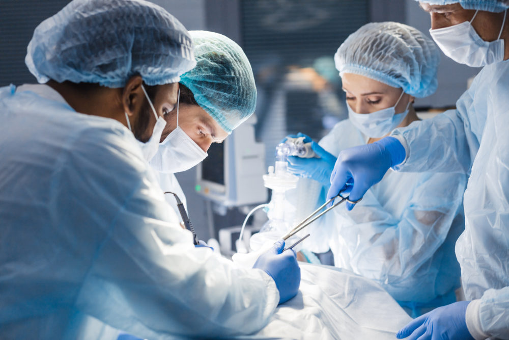 Concentrated Surgical team operating a patient in an operation theater.