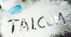 Talcum powder spelled out on surface.