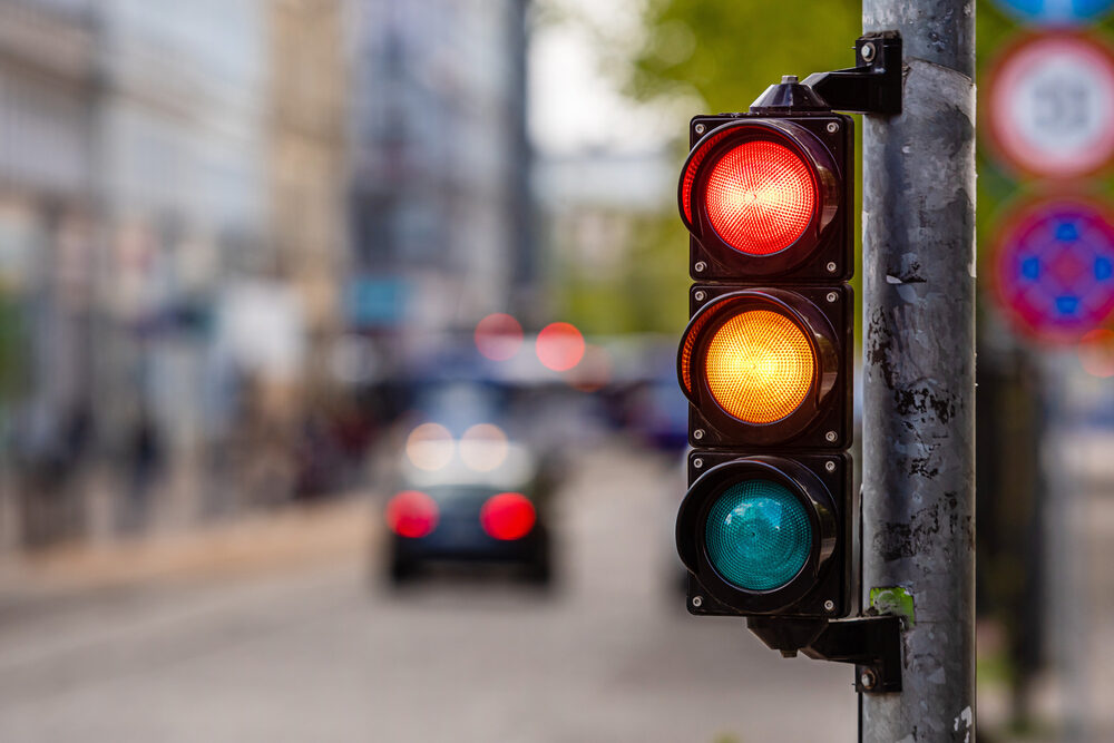 traffic light with blurred roadway background