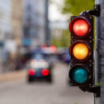 traffic light with blurred roadway background