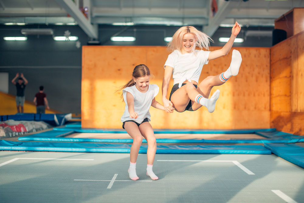 two sisters bouncing in the trampoline park