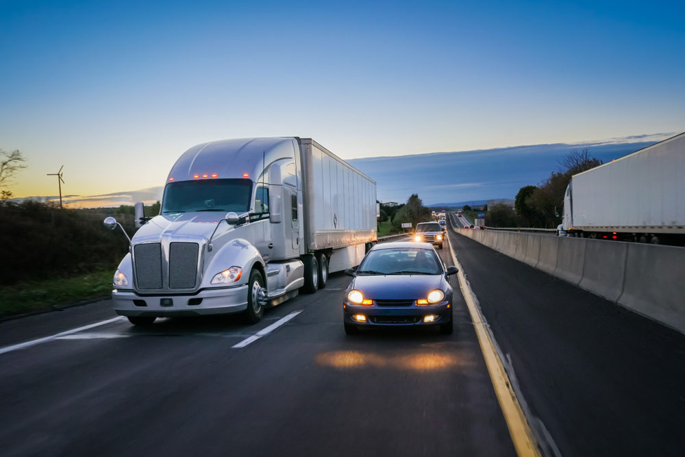 18 wheeler semi truck at night on highway