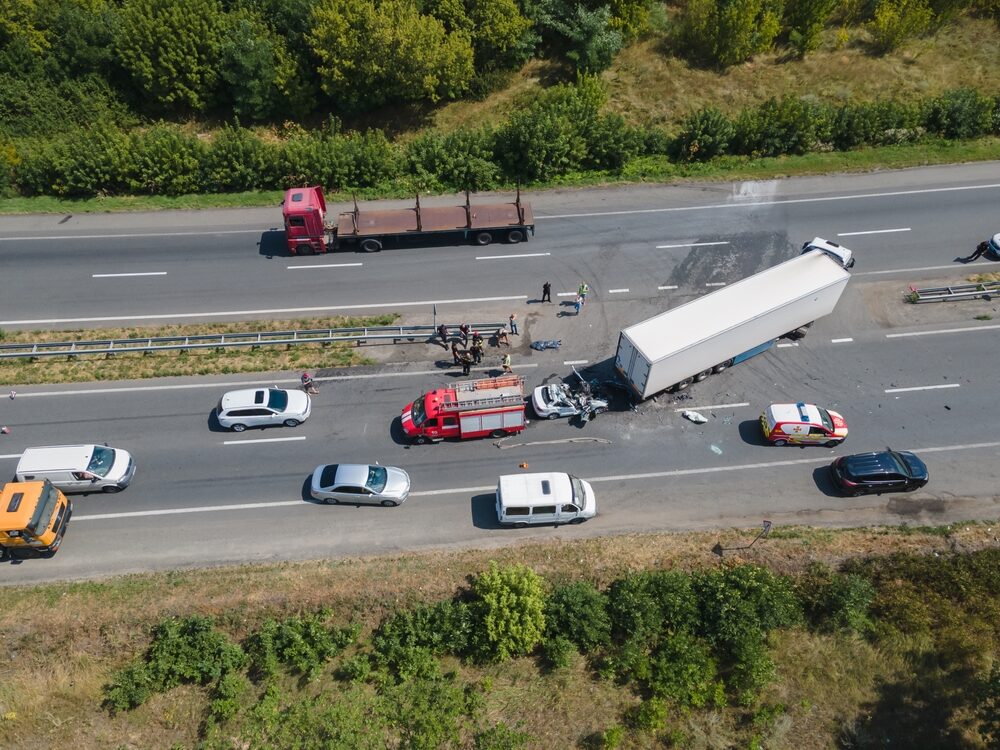 aerial view of accident where a car drove under an eighteen-wheeler