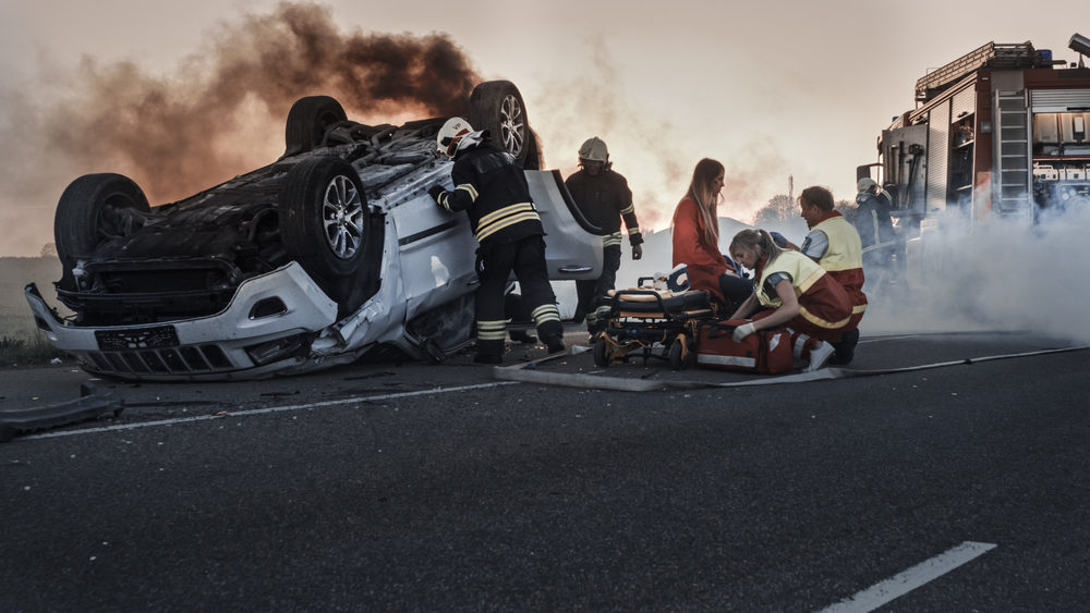 Car Crash Traffic Accident with Paramedics and Firefighters Rescue Injured Trapped Victims.