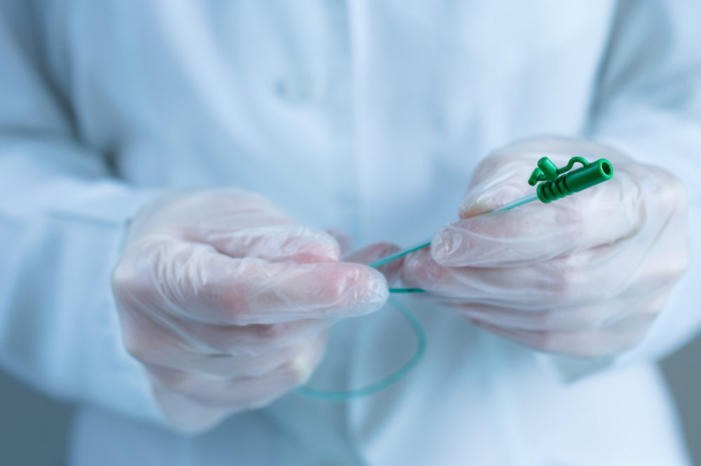 Urological catheter in the hands of a doctor. 