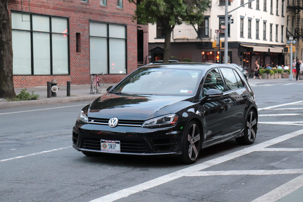 volkswagen on a road in a town