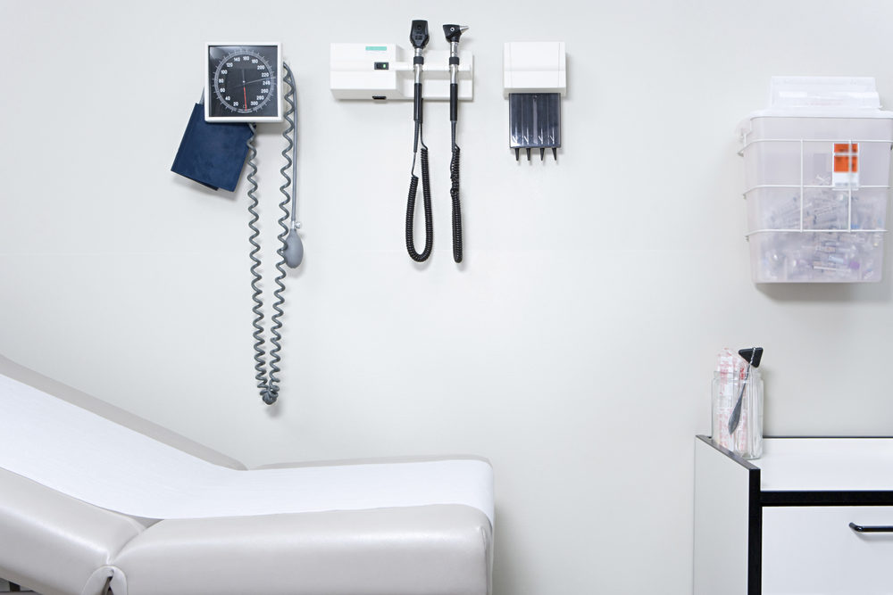 wall of empty doctor's office with equipment mounted