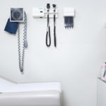 wall of empty doctor's office with equipment mounted