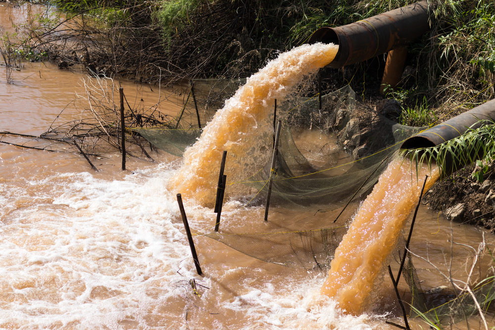 water gushing from sewer pipes