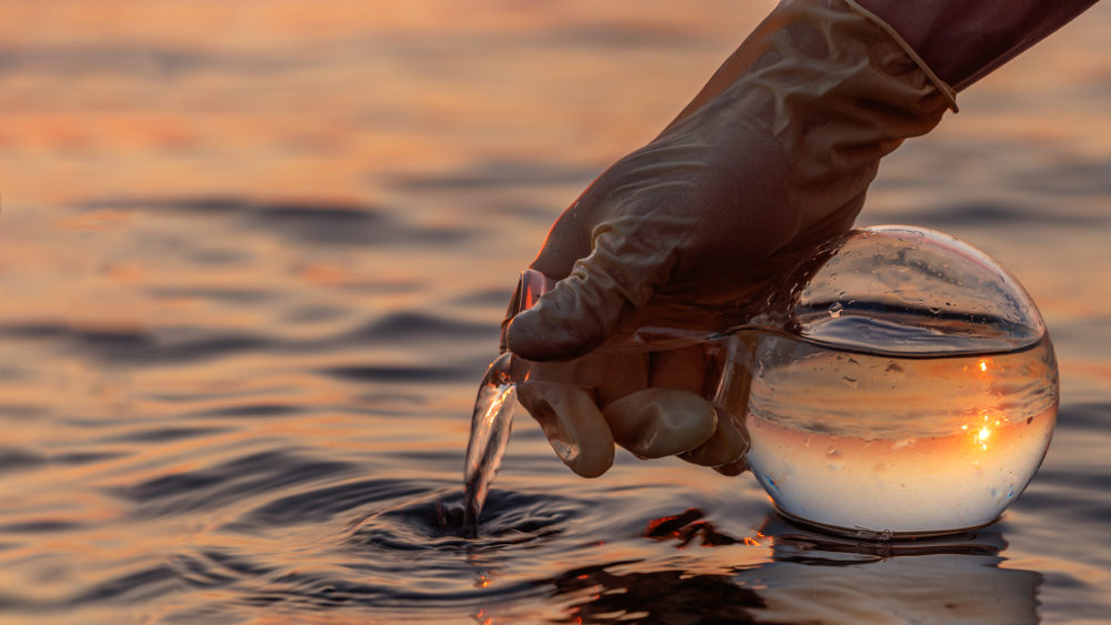 New Legislation Could Help Camp Lejeune Water Contamination Victims Seek Justice flask with a sample of water
