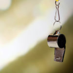 whistle closeup with abstract background