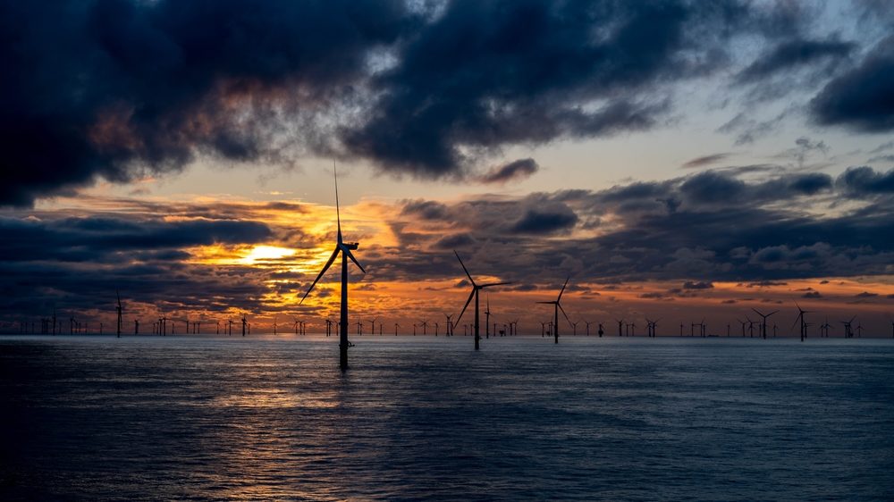 Offshore wind farm autumn sunset.