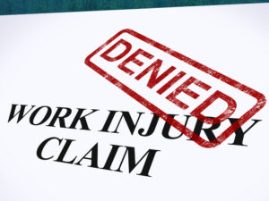 work injury claim denied on a white form