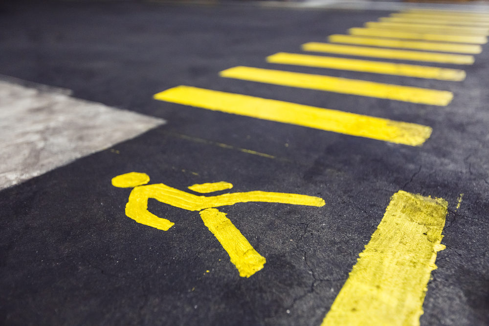 yellow pedestrian crossing marked on asphalt closeup