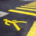 yellow pedestrian crossing marked on asphalt closeup