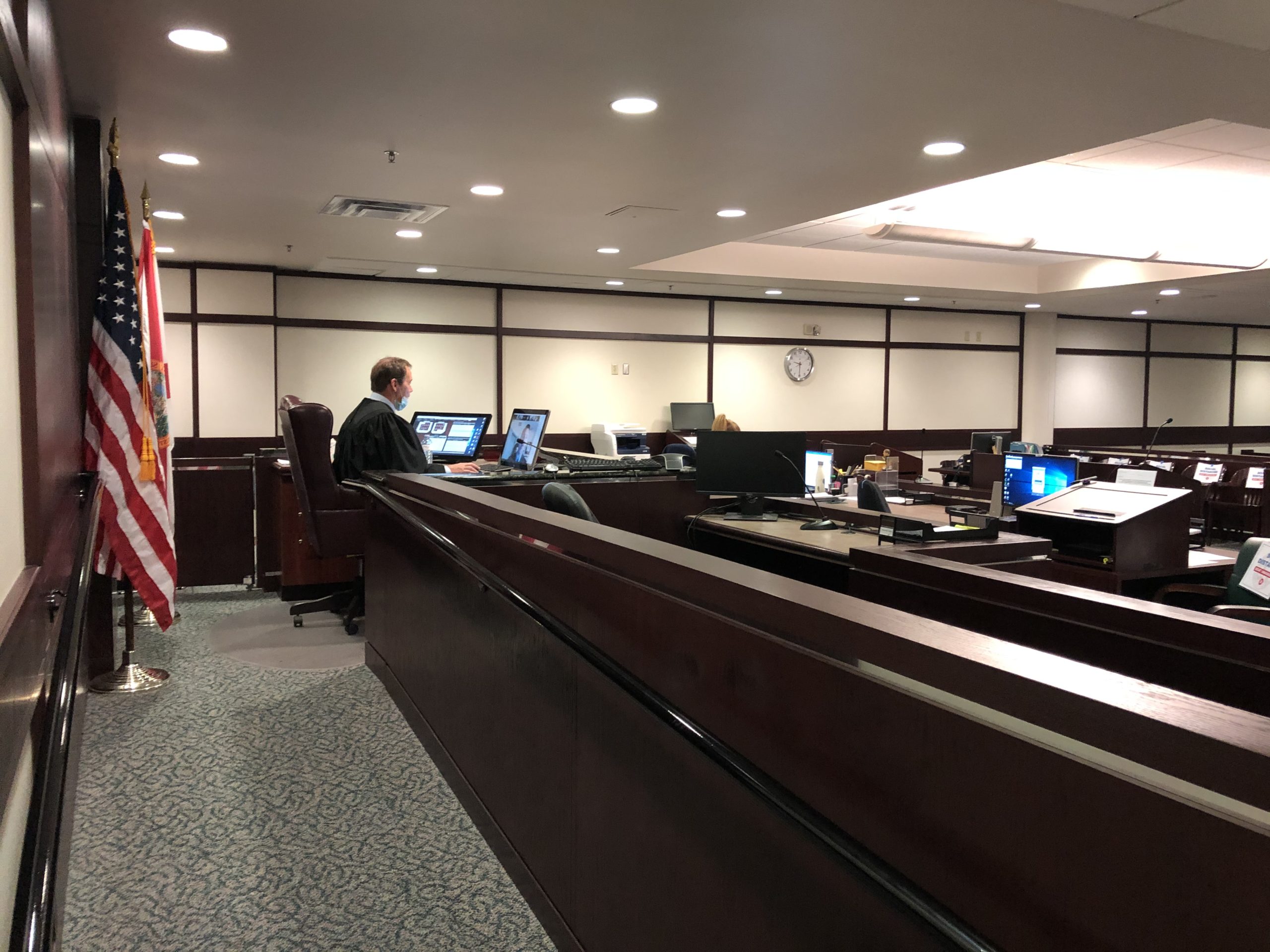Judge presiding over an empty courtroom