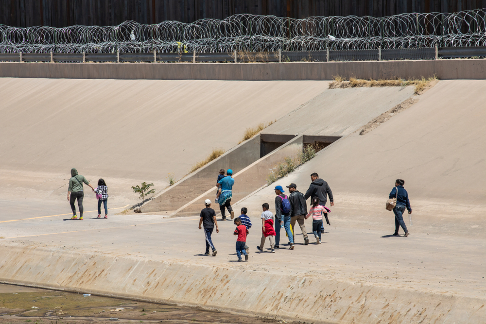 Migrants from Central America cross the US-Mexico border to seek asylum in the United States.