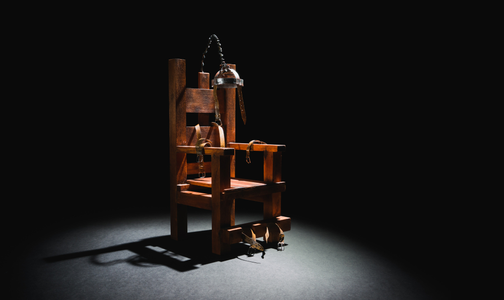 image of an electric chair scale model on a dark backgorund