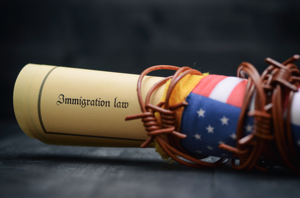 Barbed wire , Immigration Law and flag of United States Of America
