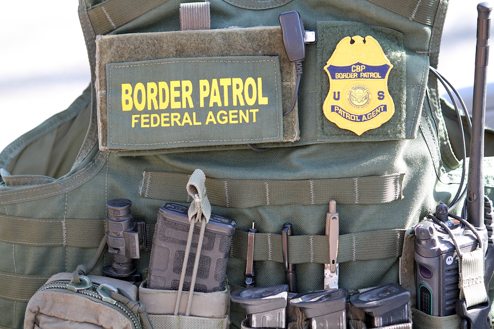 Border Patrol Federal Agent Gear on a bullet proof vest.