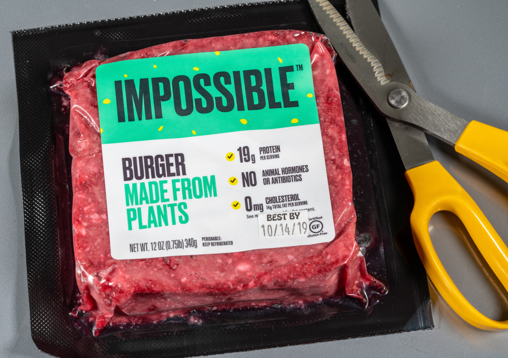 Packaging for Impossible Foods burger made from plants on steel background