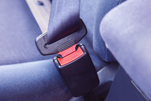 Close-up of a seatbelt buckle in a passenger vehicle
