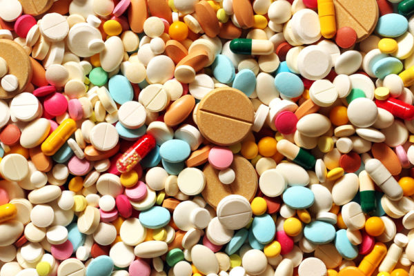 A colorful assortment of pills, tablets, and prescription drugs of all sizes