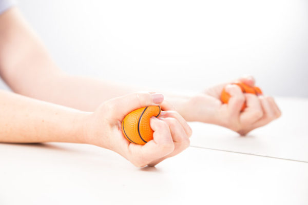 Neuropsychology test: a hand squeezing a ball tightly