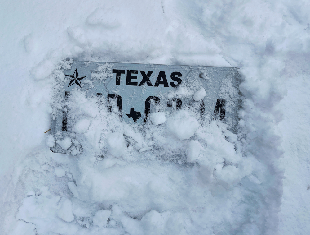 Texas license plate buried in snow