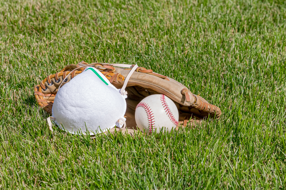 Baseball glove, ball and N95 respirator mask.