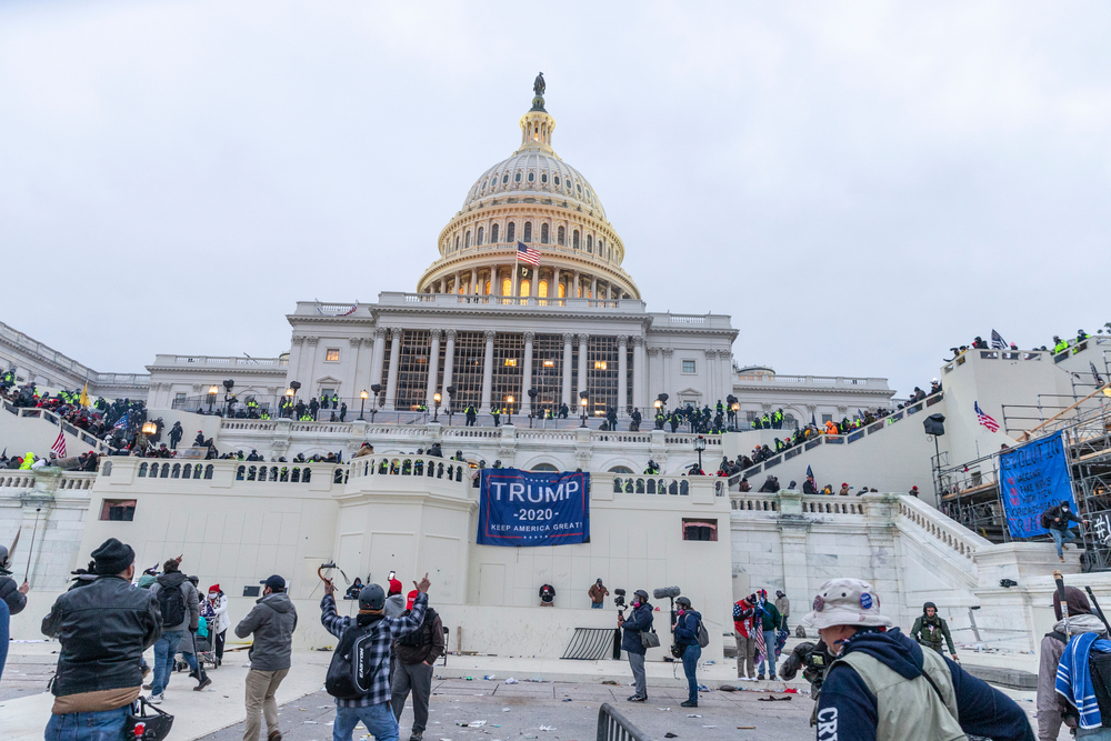 Washington, DC - January 6, 2021: Police confront rioters around Capitol building where pro-Trump supporters riot and breached the Capitol