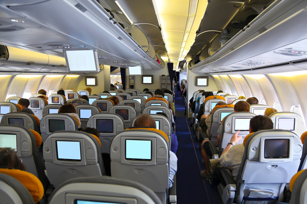 View of passengers in the cabin of a plane.