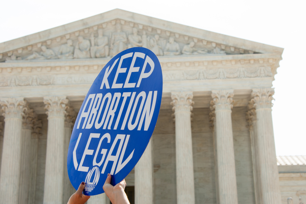 A Pro-choice activist holds a sign in front of the Supreme Court in Washington, DC