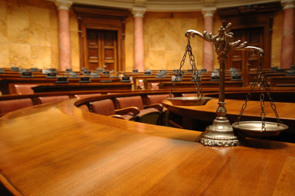 Symbol of law and justice in the empty courtroom