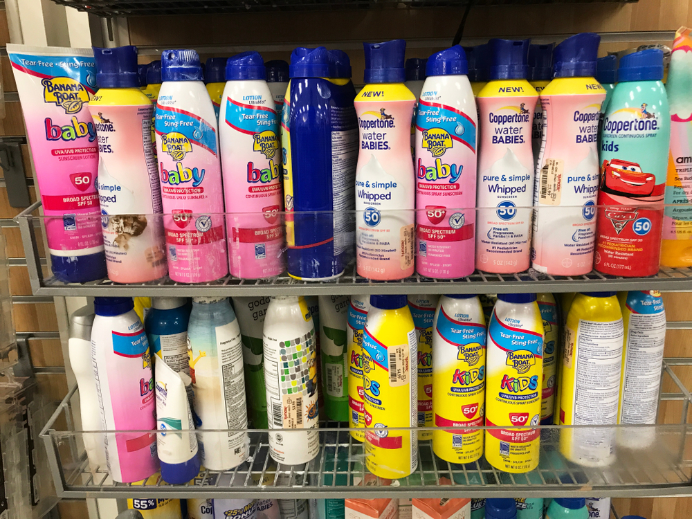 Sunscreen display in a retail store including brands for kids and babies